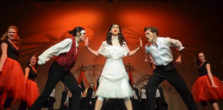 At center, Tori Brooks separates the Phantom, played by Claudia Velasco, and Raoul, played by Nick Fleming, during the final scene of Zeta Tau Alpha's "Phantom of the Opera" at the 16th annual Variety Show. - Photo by Jacob Moore