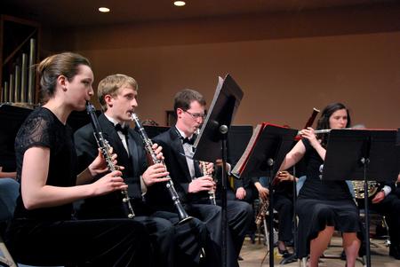 Rachel Carbonell, senior engineering major, and Andrew DiBenedetto, senior cell and molecular biology major, play in the symphonic band concert. - Photo by Anne Richoux