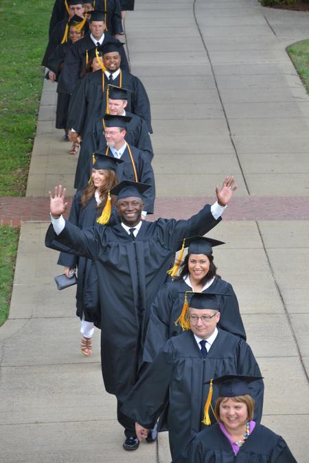 Graduates make their way to the Great Lawn during the processional for Spring Graduation. - Photo by Olivia Wallace