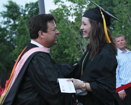 Michael Mann, assistant professor of music, congratulates Rachel Carbonell, engineering graduate, on receiving the Tigrett Medal. - Photo by Matt McDaniel
