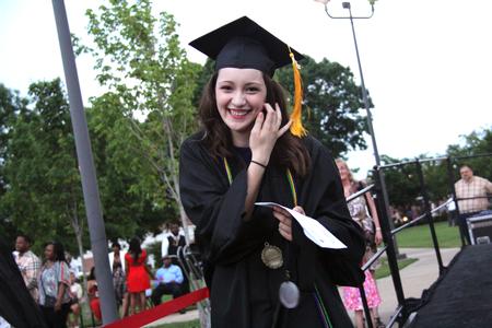 Rachel Carbonell, engineering graduate, returns to her seat after receiving the Tigrett Medal during 2013 Spring Graduation. - Photo by Matt McDaniel