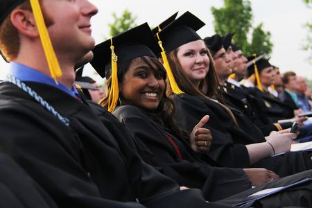 Liane Gozmao, biology and psychology double major, smiles before receiving her diploma at Spring Graduation. - Photo by Matt McDaniel