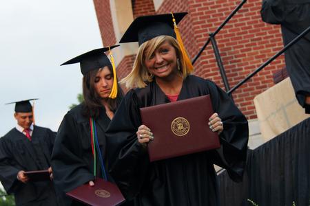 Kendra Sanderson, nursing graduate, smiles after receiving her diploma at Spring Graduation. - Photo by Matt McDaniel