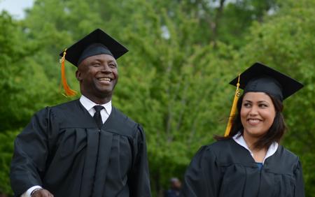 Graduates walk in the processional to the Great Lawn for Spring Graduation. - Photo by Jacob Moore