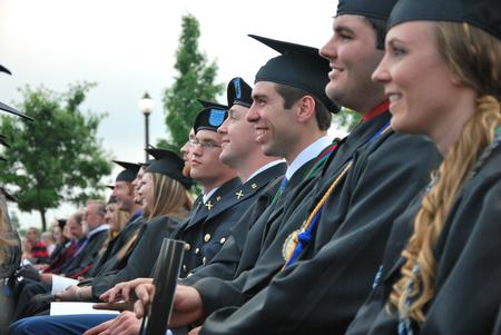 Graduates watch as their fellow classmates receive their diplomas during the 188th Spring Graduation. - Photo by Anne Richoux