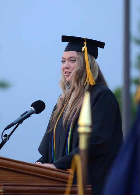 Anika Strand, senior class president and social work graduate, addresses the class of 2013 during Spring Graduation. - Photo by Jacob Moore