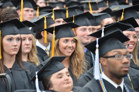 Graduates watch as Russell D. Moore makes his Commencement address during Spring Graduation. - Photo by Morris Abernathy