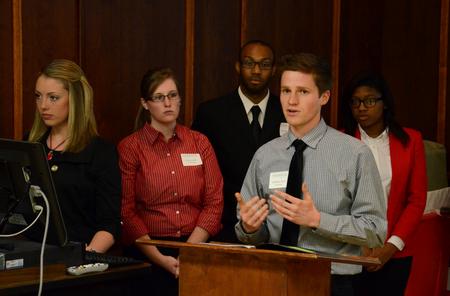 Jeff Paul, senior psychology major, presents at the 10th annual Scholarship Symposium on the correlation between academic entitlement and academic dishonesty with Joshua Morgan, Ariell Beasley, Darcie Williams and Lydia Dahl. - Photo by Jacob Moore