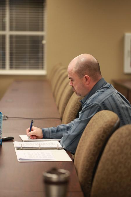A student in the BSOL program takes notes in class.  - Photo by Kristi McMurry Woody