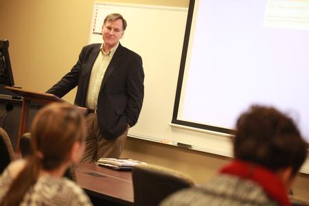 Robert Simpson, associate vice president for business services, teaches a class in the Center for Continuing and Professional Studies.  - Photo by Kristi McMurry Woody