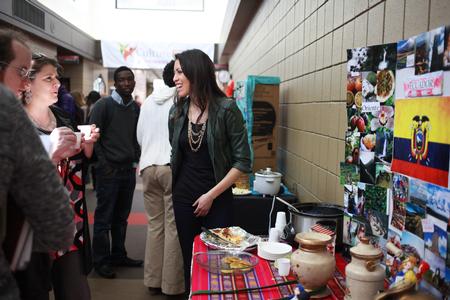 Claudia Velasco explains her booth all about studying in Ecuador at the External Study fair in the SUB during CultureFEST.  - Photo by Kristi McMurry Woody