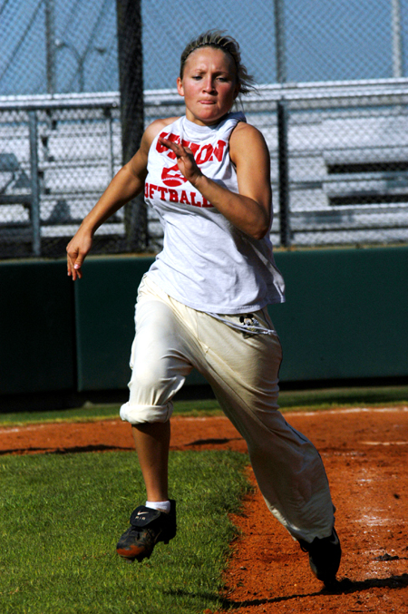 Mary Kosco prepares to make a turn at first during a Lady Bulldog practice. - Photo by Jonathan Blair