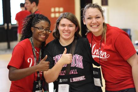 Freshmen Olivia Howard, graphic design major, Patricia Decker, sports management major, and Emily Kigore, pre-dental major, pose at the ice cream social in the Bowld Student Commons. - Photo by Matt McDaniel