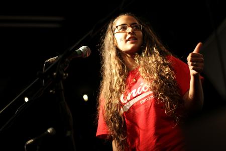 Paula Nestico, freshman computer science major, sings with her sister, Eugenia, at open mic night at Barefoots Joe. - Photo by Matt McDaniel