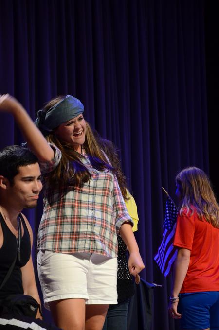 Anna Isbell, junior English major, performs the skit "If I weren't a Focus leader" as a truck driver during the Focus show for new students. - Photo by Anne Richoux