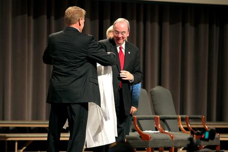David S. Dockery, president of the university, receives an honorary white coat to thank him for his leadership role in the development of the program. This was part of the annual white coat ceremony.  - Photo by Kristi McMurry Woody