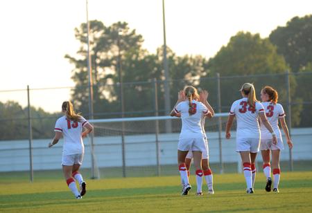 The Lady Bulldogs soccer team energetically takes the field after halftime in a game against Rhodes College.  - Photo by Amanda Rohde