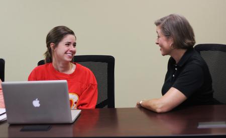 Brooke Emery, assistant professor of marketing, and Sara Clarke Mason, sophomore social work major, discuss the future projects coming up for Enactus. - Photo by Matt McDaniel