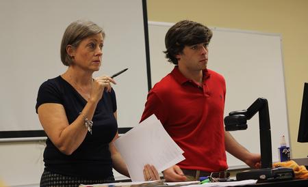 Brooke Emery, assistant professor of marketing, and Matt Street, senior management major, lead an Enactus meeting. - Photo by Matt McDaniel