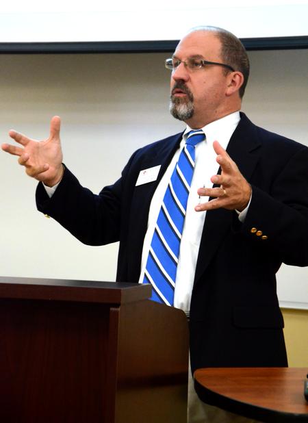 Scott Huelin, associate professor of english and director of the honors community, speaks on "The Ars Moriendi in Literature" at the Town and Gown lecture series.  - Photo by Amanda Rohde