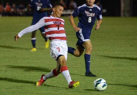 Briamst Castro, senior sports medicine major, looks to dish the ball to a teammate during a game against the Lee University Flames. The Bulldogs tied the game 1-1. - Photo by Matt McDaniel