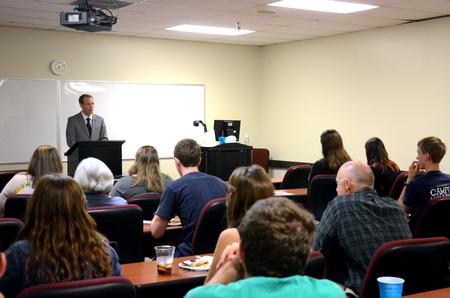 Students listen as Adam Mcleod, associate professor of law at Faulkner Univ., gives a lecture in the Penick Academic Complex.  - Photo by Anne Richoux