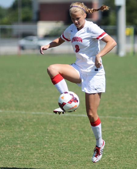 Madison Purdy, sophomore mathematics major, settles the ball at the alumni soccer game during Family Weekend.  - Photo by Matt McDaniel
