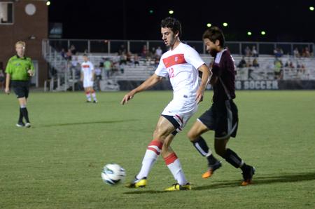 Bulldog Jamie Fox dribbles the ball downfield during a game against Christian Brothers University at the Smith Memorial Soccer Complex. - Photo by Anne Richoux