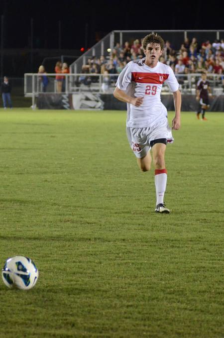 Bulldog Connor Burns runs to keep possession of the ball during a game against Christian Brothers University. - Photo by Anne Richoux