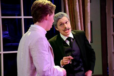 Peter Riggs, senior philosophy major, and Garyn McIntyre, freshman theatre and psychology double major, perform in G.K. Chesterton's "Magic: A Fantastic Comedy" in the W.D. Powell Theatre. - Photo by Amanda Rohde