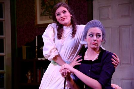 Bryanna England, sophomore theatre and broadcasting double major, and Allison Hearn, senior theatre major, perform in G.K. Chesterton's "Magic: A Fantastic Comedy" in the W.D. Powell Theatre. The show was directed by David Burke.  - Photo by Amanda Rohde