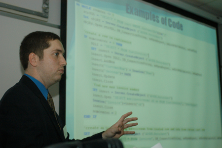 Senior Justin Snyder, computer science major, presents <i>A Shopping Cart and Invoicing System for Foodservice Products</i> during the university's first scholarship symposium. - Photo by Justin Veneman