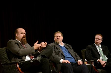 Micah Watson (left), director of the Center for Politics and Religion and associate professor of political science, speaks to students, faculty, and staff during a religious liberty panel in chapel.  - Photo by Anne Richoux