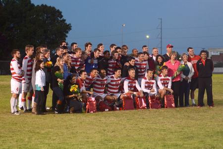 Bulldogs varsity soccer team poses for a group picture with the senior players and their families at Senior Night. - Photo by Amanda Rohde