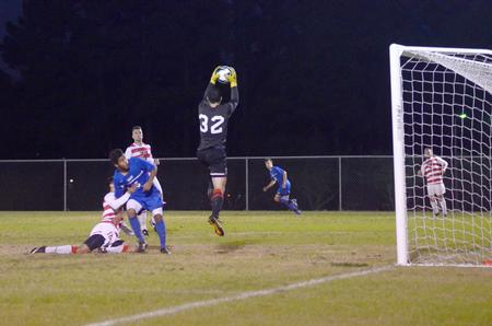 Bulldog goalkeeper Matt Kesler, sophomore philosophy major, blocks the University of Alabama at Huntsville from scoring. - Photo by Amanda Rohde