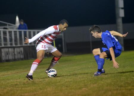 Bulldog Diego Santos challenges an opponent for the ball during the Senior Night home game against the University of Alabama at Huntsville. - Photo by Amanda Rohde