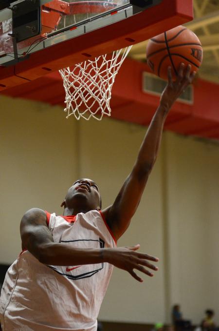 Corieon Pearson, junior business administration major, reaches for a two-pointer during a scrimmage game at Bulldog Madness in the Fred DeLay Gymnasium. - Photo by Jacob Moore