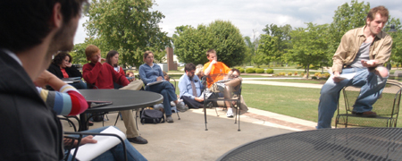 Junior Patrick Myers reads a selection from his creative writing course during the university's first scholarship symposium. - Photo by Kristen Nicole Sayres
