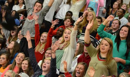 Students reach for t-shirts being launched into the crowd during Bulldog Madness in the Fred DeLay gymnasium. - Photo by Jacob Moore