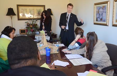 Ben Burleson, programming coordinator, and Esperanza Aguilar, student success advocate, teach students how to write a professional resume at the Vocatio Center's Walk-In Wednesday. - Photo by Amanda Rohde
