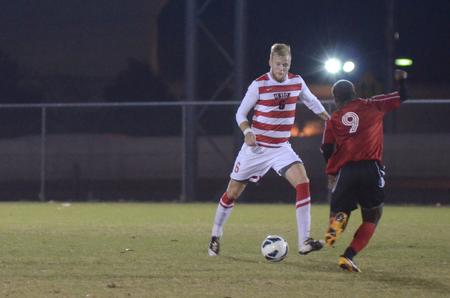 Krister Andreassen dribbles the ball around a Tennessee Temple University player during the quarterfinals of the National Christian College Athletic Association MidEast Region Tournament. Union won 6-1.  - Photo by Anne Richoux