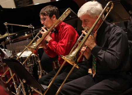 Ryan Shaw, left, sophomore computer science major, and Bill Nettles, right, professor of physics, play trombone during the jazz band concert in Hartley Recital Hall. - Photo by Matt McDaniel