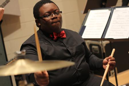 Ryan Nelson, freshman music education major, plays the drums at the annual jazz band concert.  - Photo by Matt McDaniel