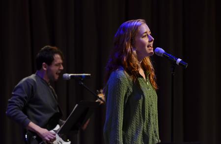 Kelsey Leaf, sophomore public relations major, leads music in chapel  with Rob Griffith, senior English major. - Photo by Jacob Moore