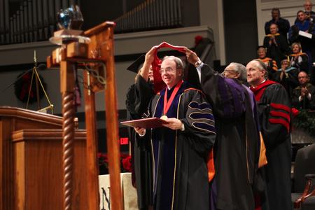 David S. Dockery, president of the university, receives his doctoral hood during the Fall Commencement Services at West Jackson Baptist Church - Photo by Matt McDaniel