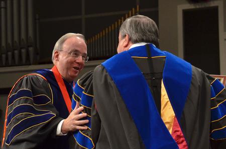 David S. Dockery, president of the university, makes the Robert E. Craig Service Award presentation to J. Michael Duduit, Dean of the College of Christian Studies at Anderson University. - Photo by Morris Abernathy