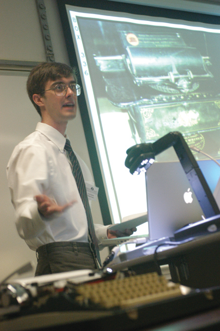 Senior Allen Smith, computer science & mathematics major, presents "Letting Your Fingers Do Too Much Walking: The Distance Traveled While Typing," a paper on the benefits of the Dvorak keyboard during the university's first scholarship symposium. - Photo by Lindsay Stavish