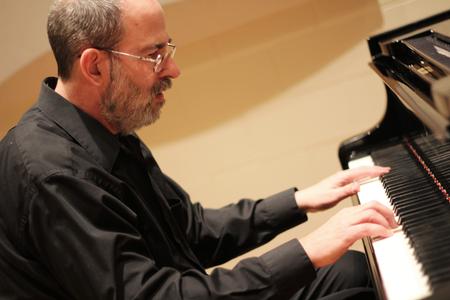 Terry McRoberts, university professor of music, performs a faculty piano recital in Hartley Hall. - Photo by Matt McDaniel