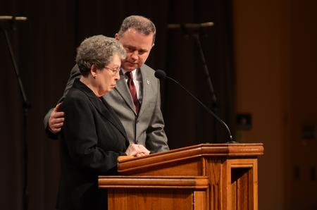 Todd Brady, vice president for university ministries, comforts Betty Bedsole, professor of music, in the middle of the responsive reading during the prayer chapel in remembrance of Olivia Greenlee. - Photo by Matt McDaniel
