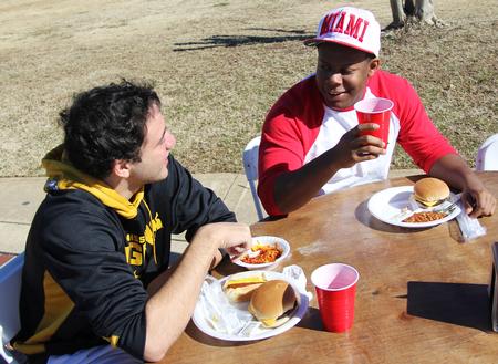 Jeremy Ebert, freshman business administration major, and Marcellous Jiles, freshman elementary education major, enjoy some burgers and hot dogs at the Union Strong event during homecoming weekend. - Photo by Matt McDaniel